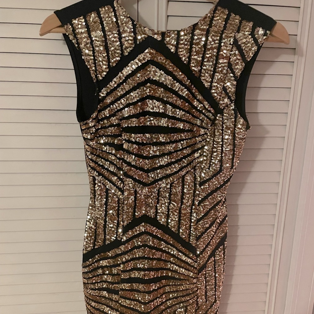 Black and gold sequins cocktail dress.